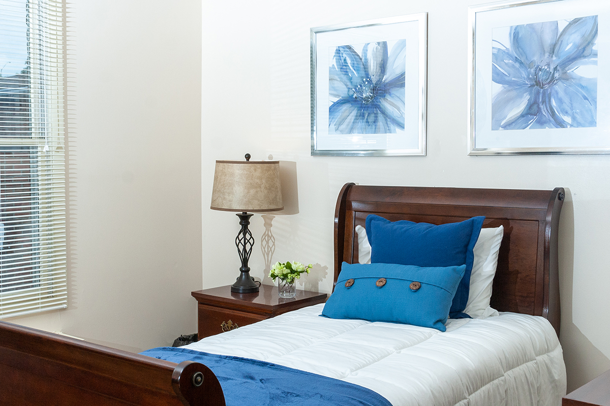 Comfortable bedroom suite at Independence Court of Monroeville